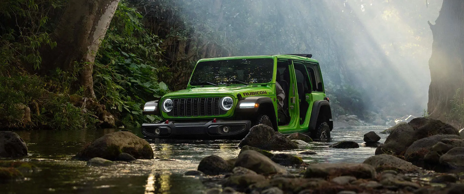 2026 Jeep Wrangler Rubicon showing trail-ready capability — competitor to the Ford Bronco in the off-road SUV segment