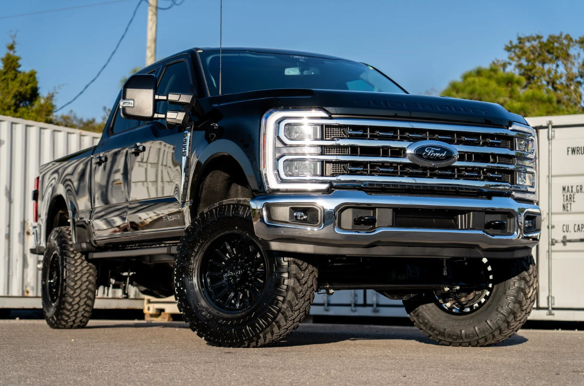 Lineup of custom lifted Ford F-150 trucks built by 707 Performance at Sarasota Ford