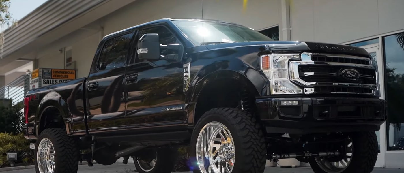 Ford-trained technician working on a vehicle in the service bay at Sarasota Ford