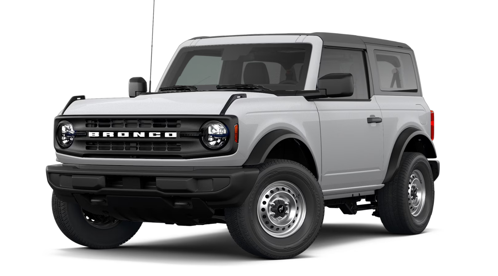 Ford Bronco with removable doors and roof panels parked at a trailhead