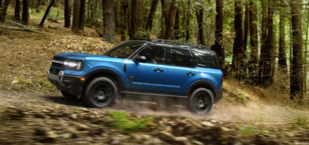 2026 Ford Bronco in blue on an outdoor off-road trail
